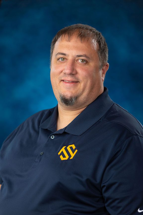 Headshot of Andrew Buscher